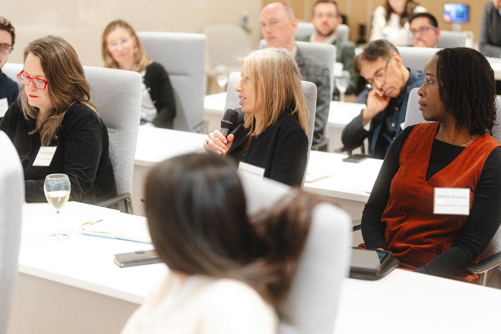 An attendee asking a question during the discussion