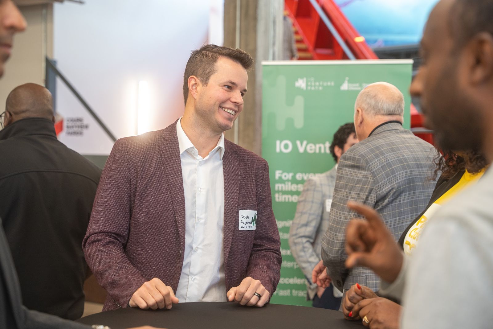 Attendees networking at a community event