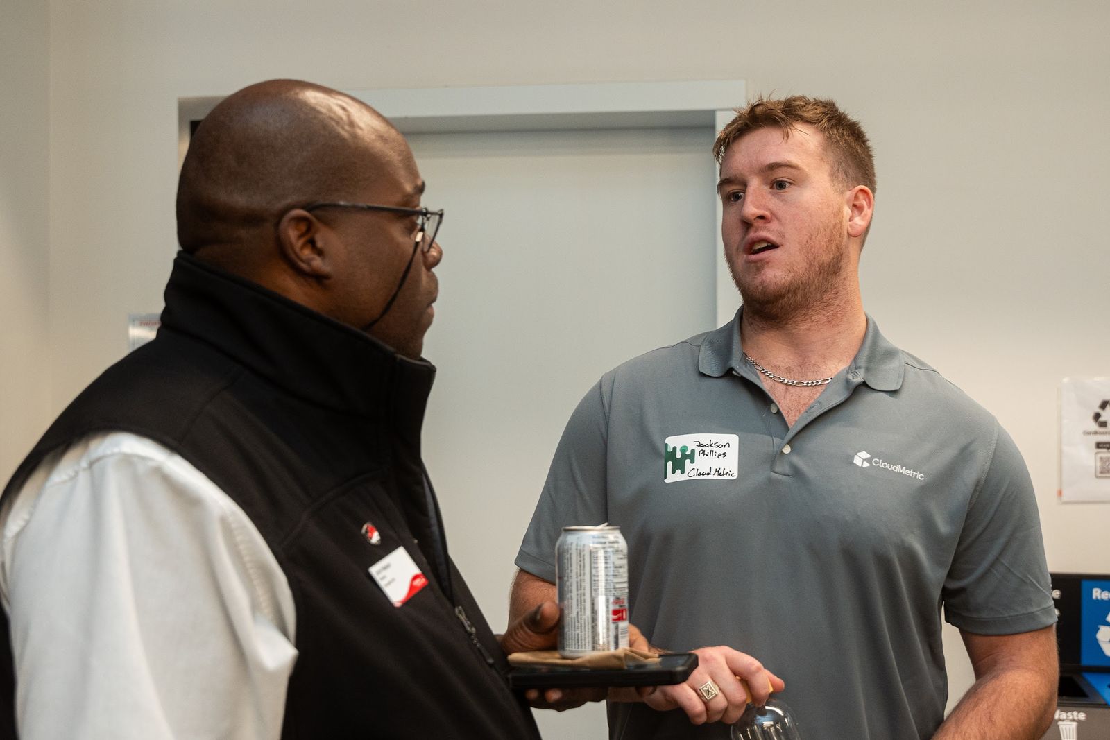 A conversation between attendees at the Launchpad